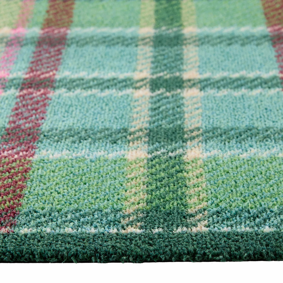 Close-up of Hug Rug green tartan pattern

