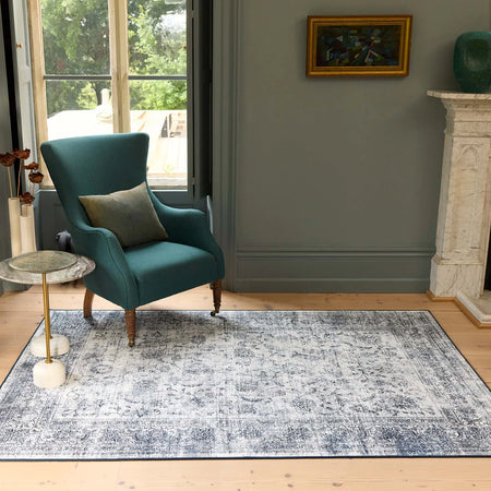 Traditional-style rug with medallion motif and navy border

