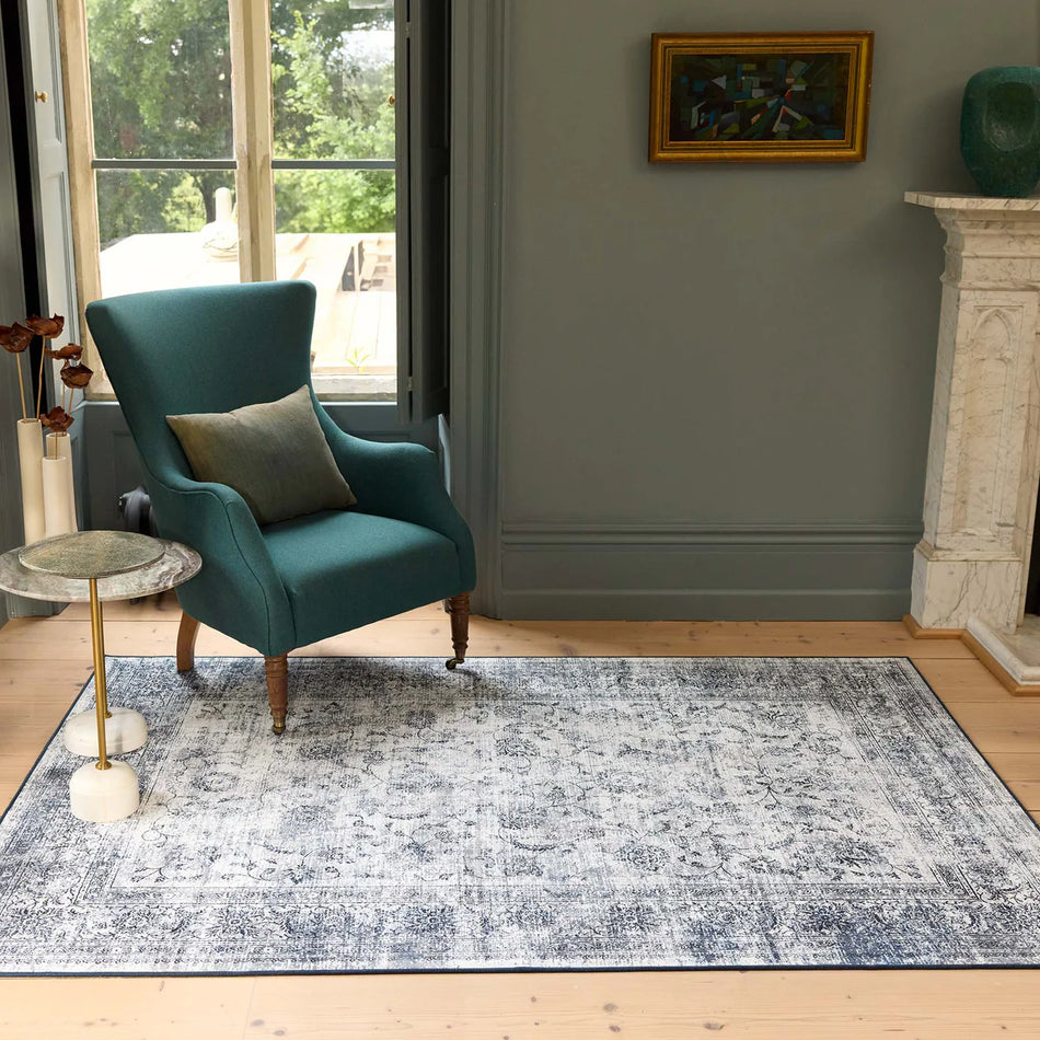 Traditional-style rug with medallion motif and navy border

