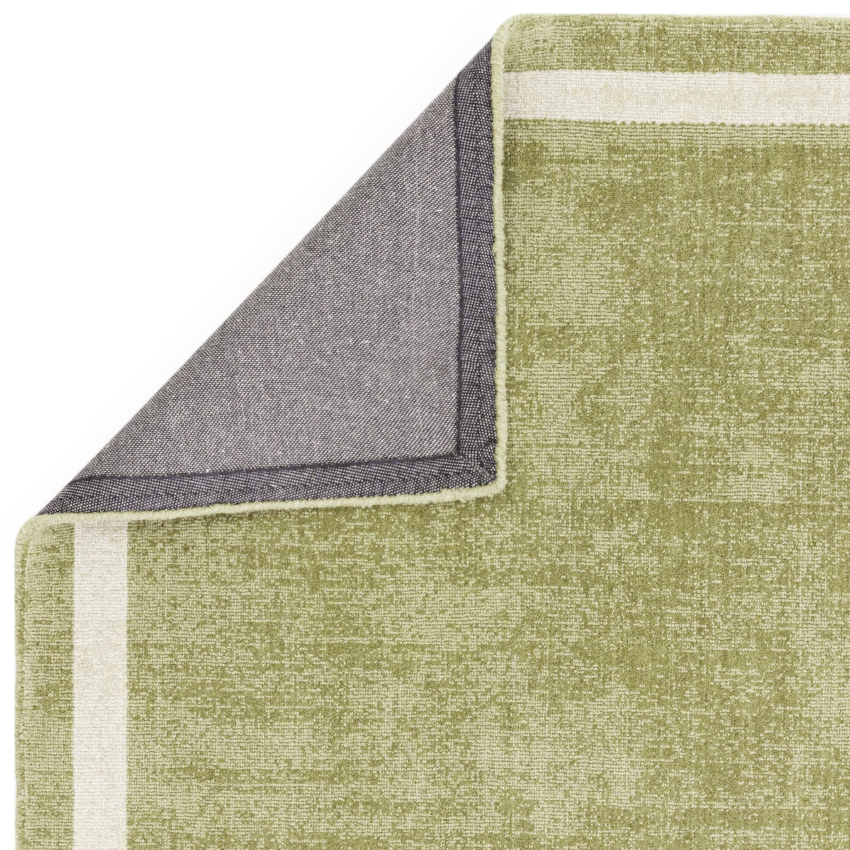 Earthy green rug in botanical decor

