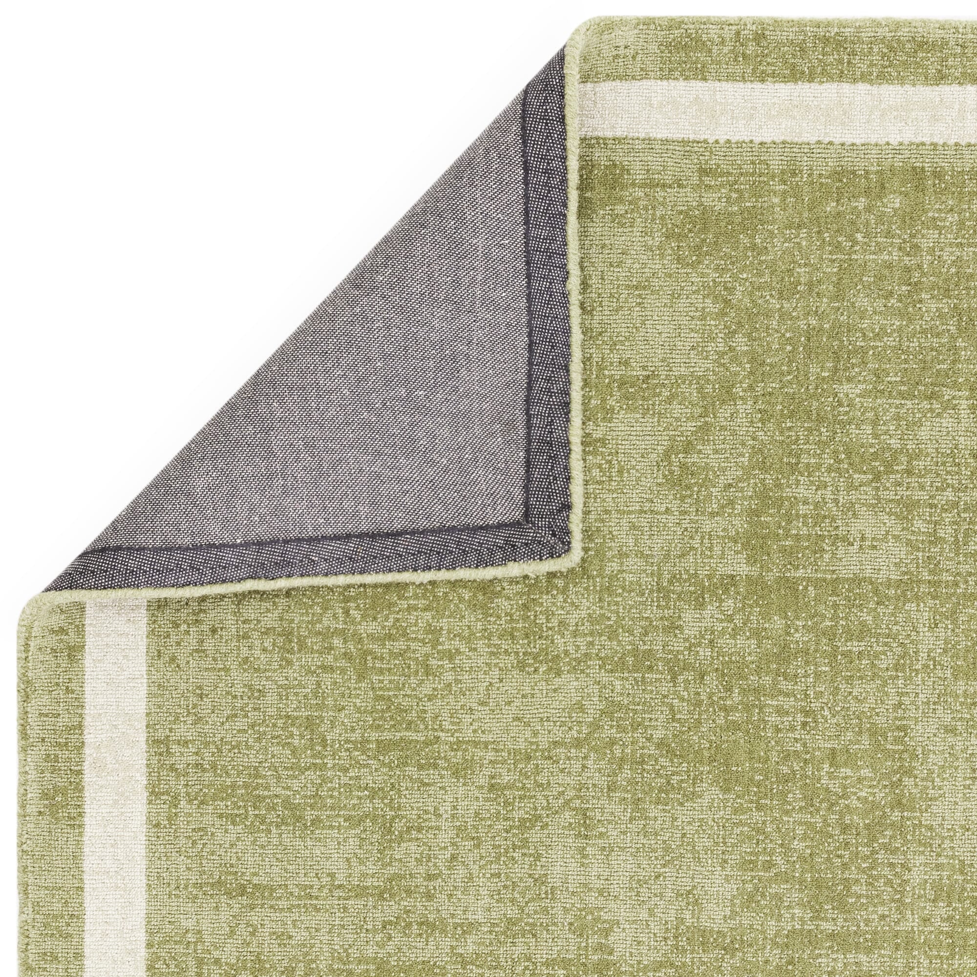 Earthy green rug in botanical decor

