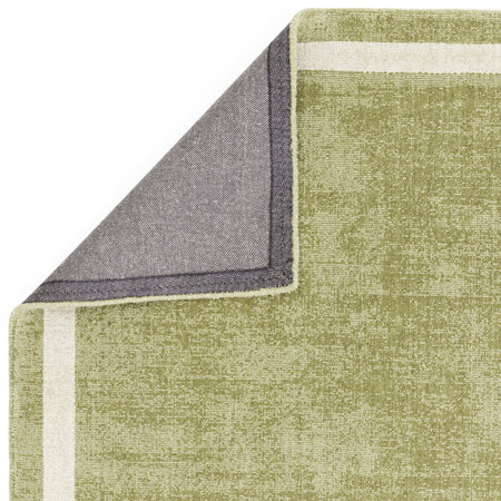 Earthy green rug in botanical decor

