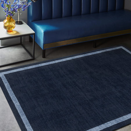 Navy Albi rug styled in modern living room


