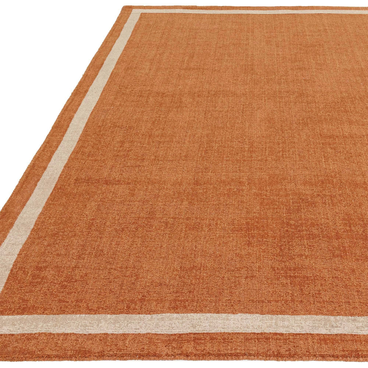 Burnt orange rug styled in rustic living room

