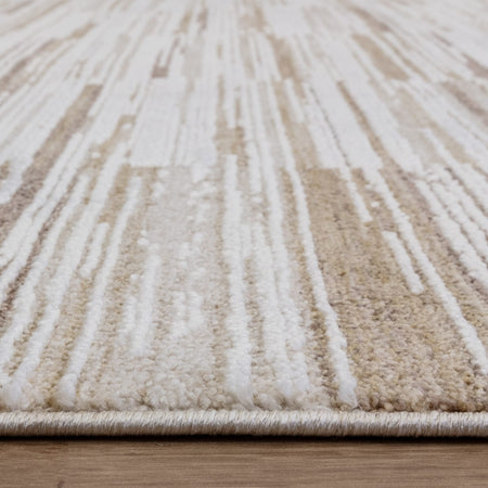 Textured rug on light wood flooring

