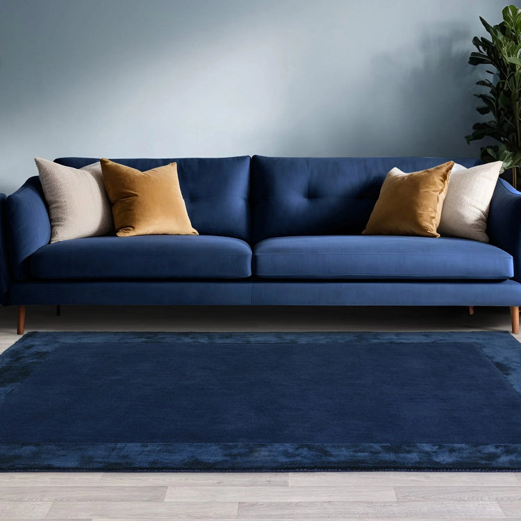Navy bordered rug hand woven in India

