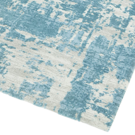 Asiatic Astral blue rug styled with grey décor

