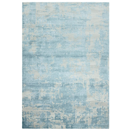 High-shine blue rug with abstract design

