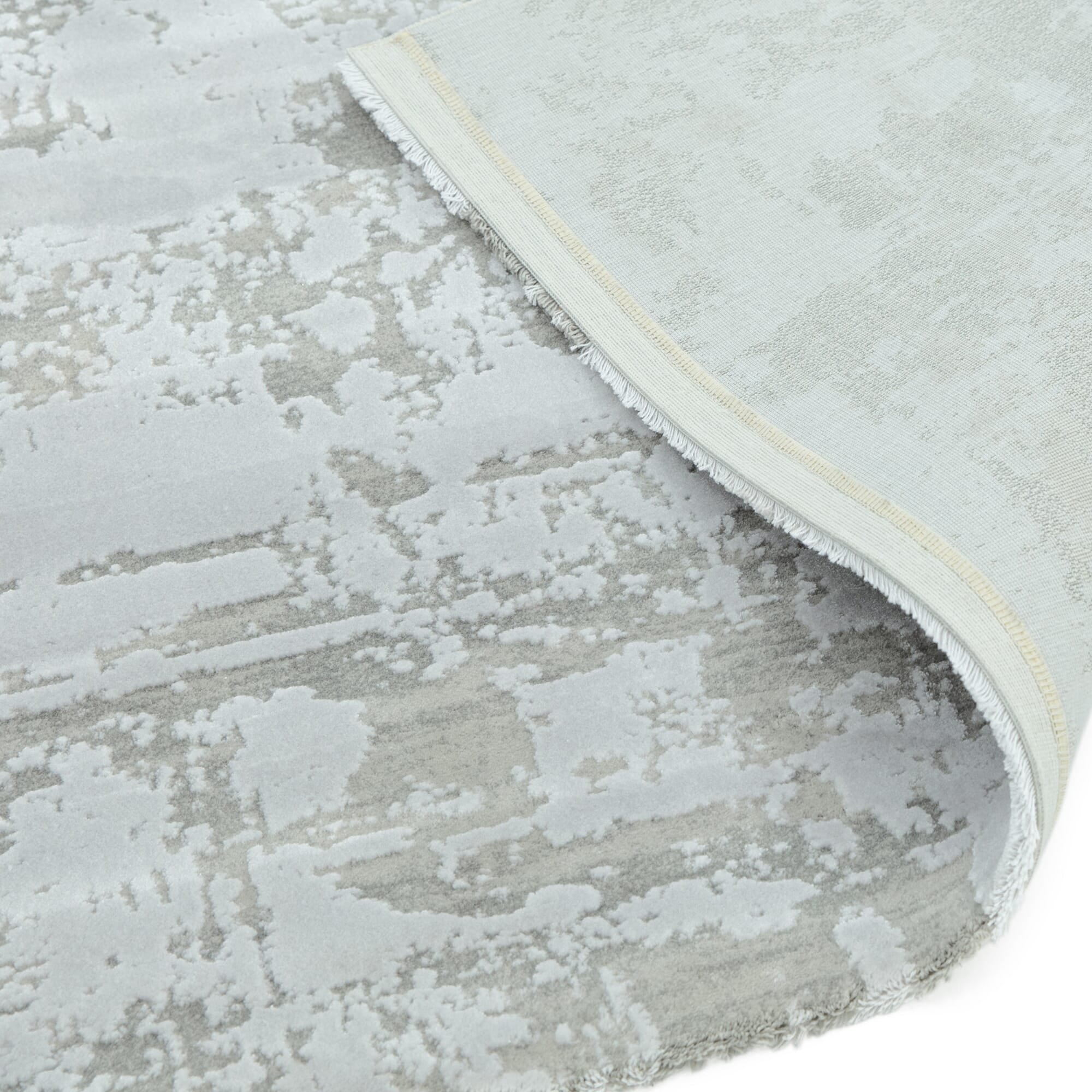 Abstract distressed silver rug in modern interior

