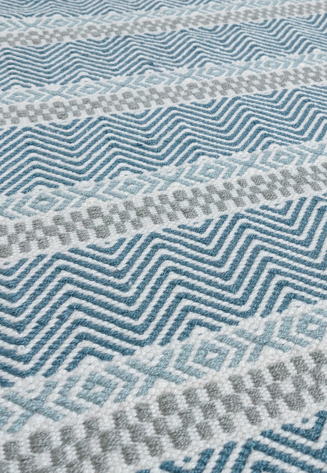 Multi-colour blue stripe rug on patio


