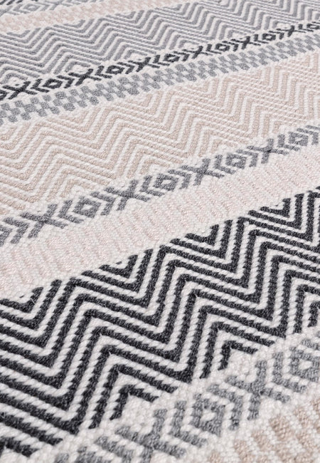 Hand woven grey stripe rug close-up

