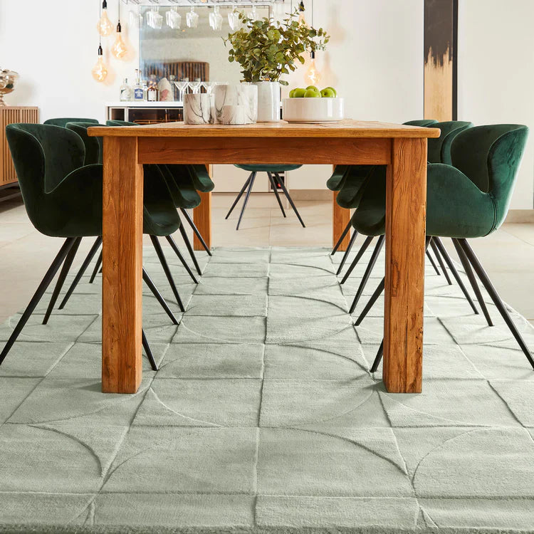 Origins Penny Rug Eucalyptus green wool rug in modern dining room