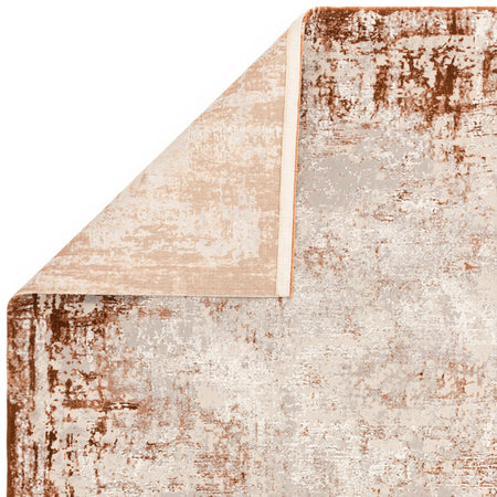 Terracotta rug styled in a cosy lounge

