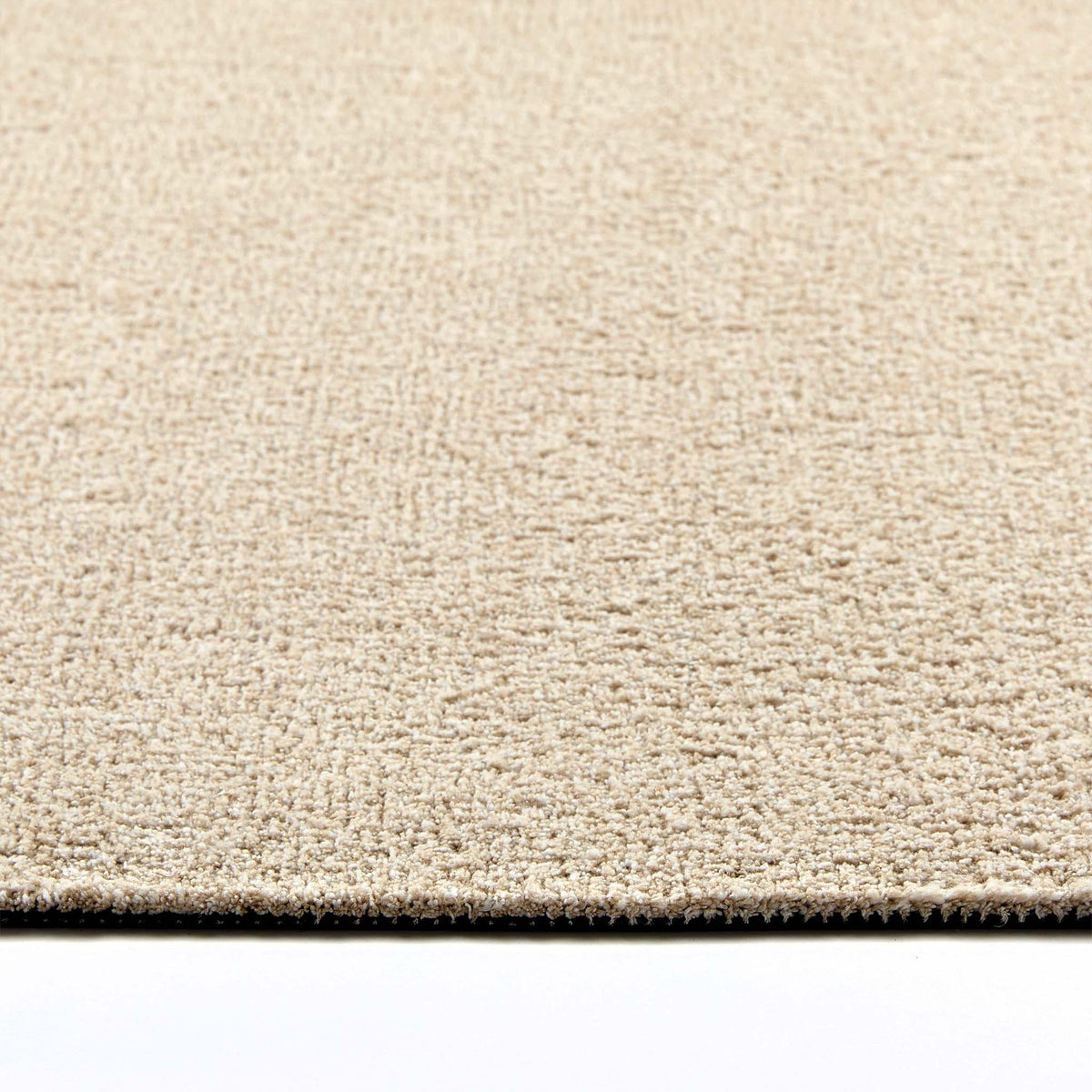 Close-up of Hug Rug beige fleck texture


