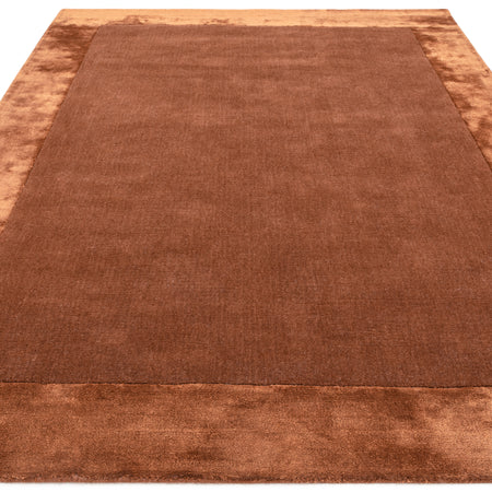 Rust border hand woven rug

