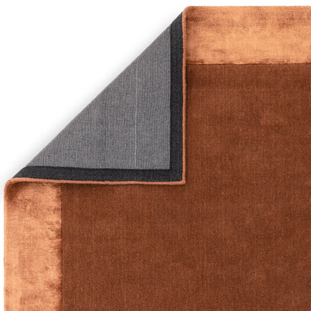 Ascot collection rug with red-rust edge

