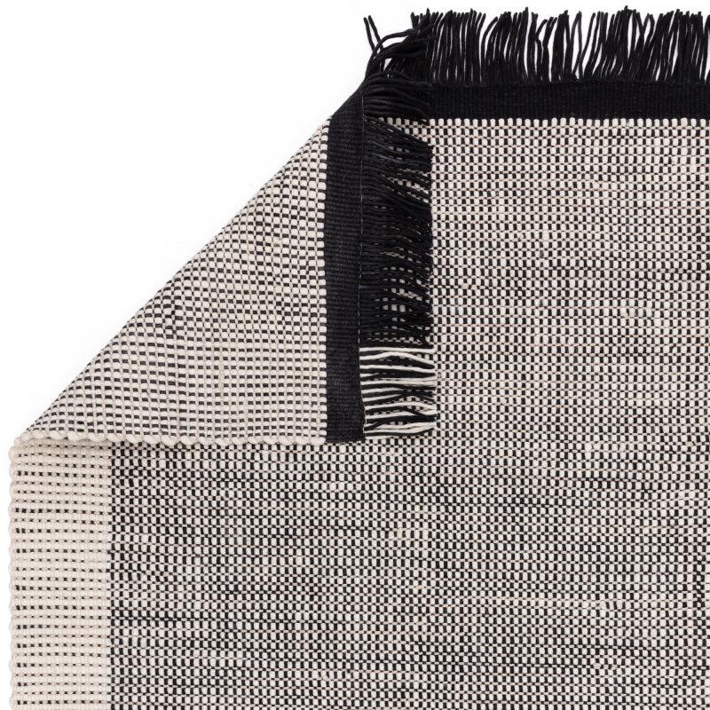 Artisan-crafted black and white rug

