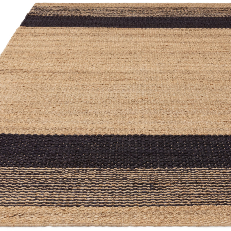 Minimalist rug with dark stripe accents

