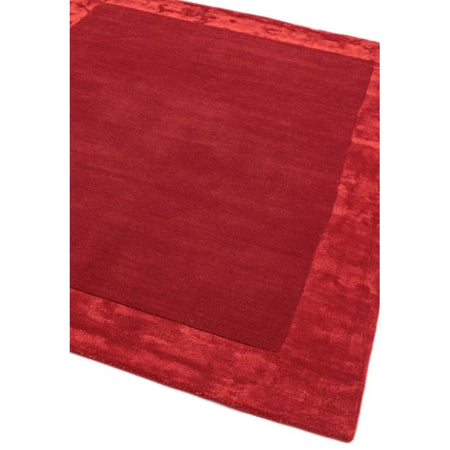 Wool and viscose rug with red edge

