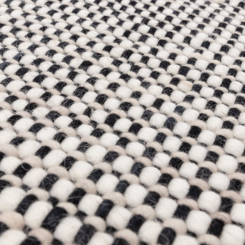 Minimalist Avalon rug on wooden floor

