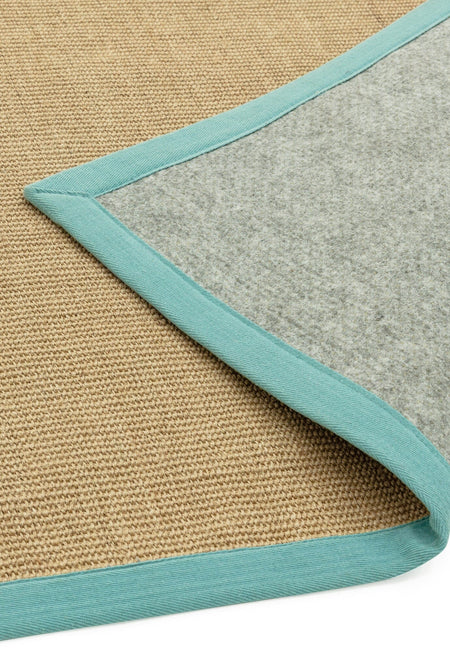Sisal rug with aqua cotton border showing non slip backing