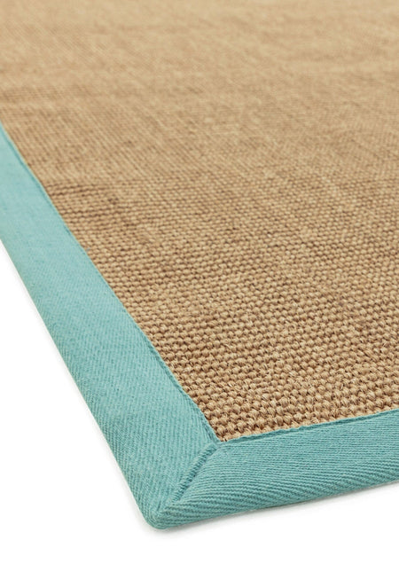 Natural fibre rug with pastel aqua cotton trim