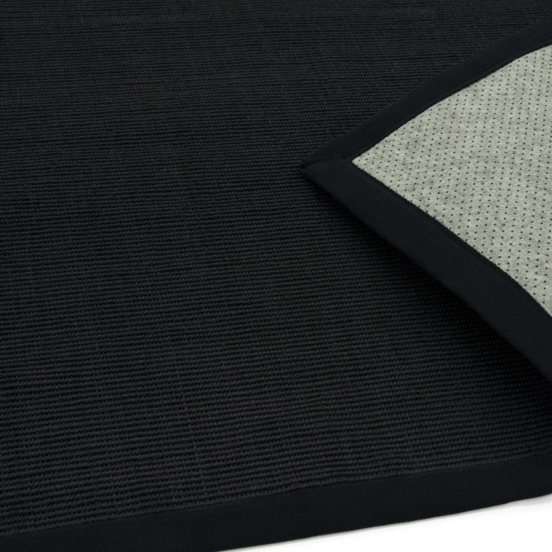 Sisal and cotton black-bordered rug close-up