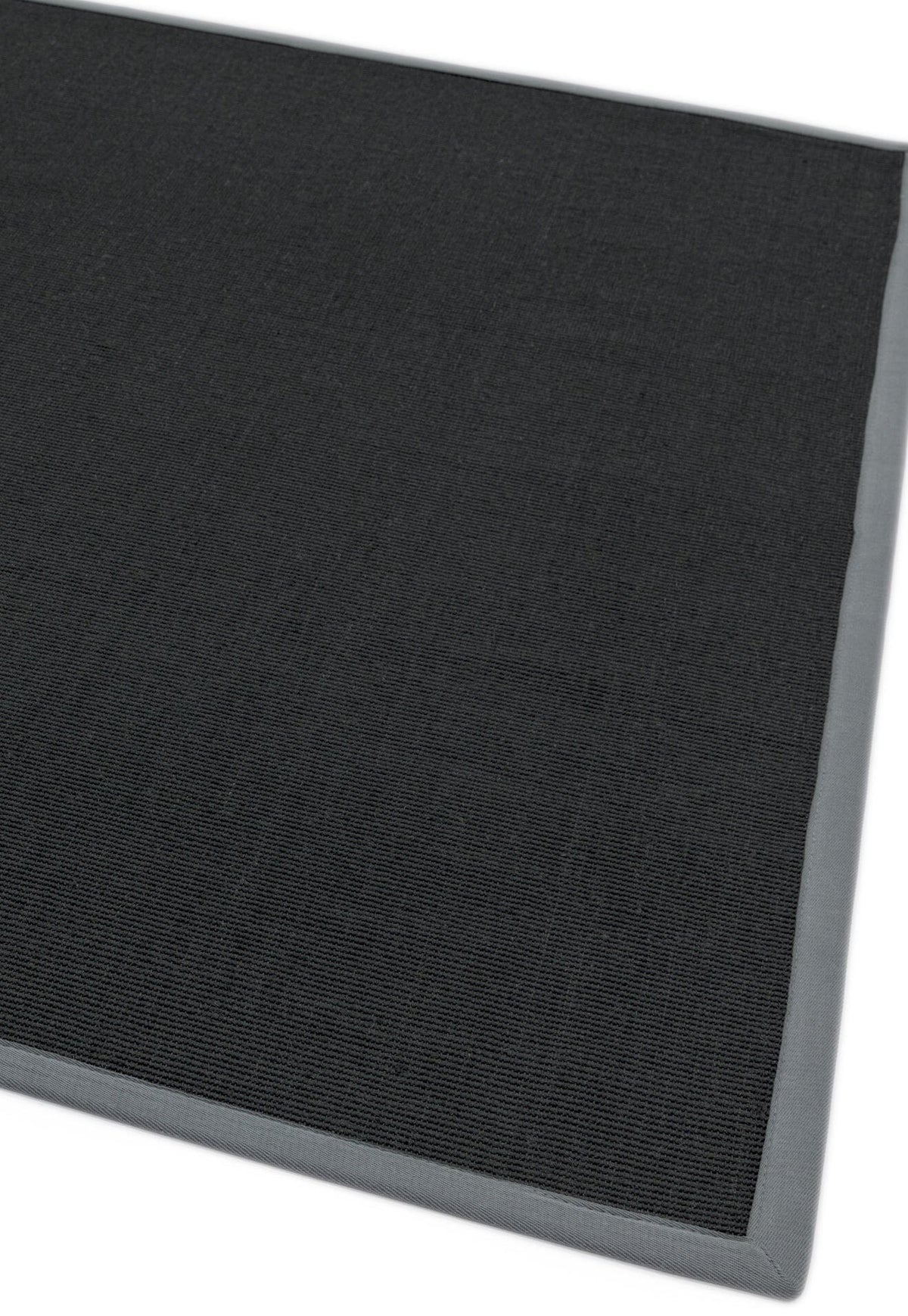 Modern interior with sisal and grey bordered rug