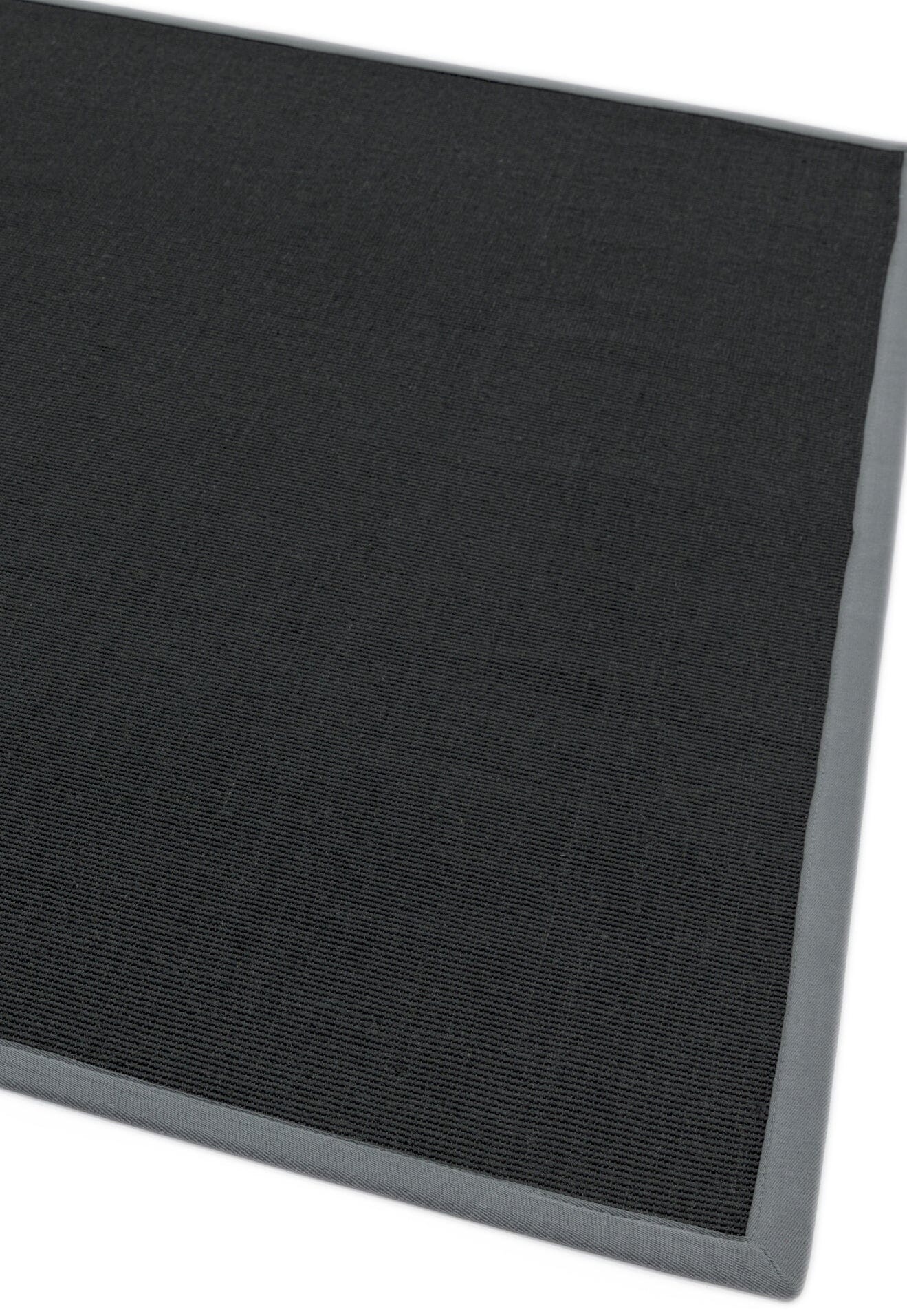 Modern interior with sisal and grey bordered rug