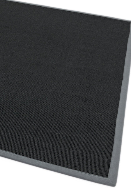 Modern interior with sisal and grey bordered rug