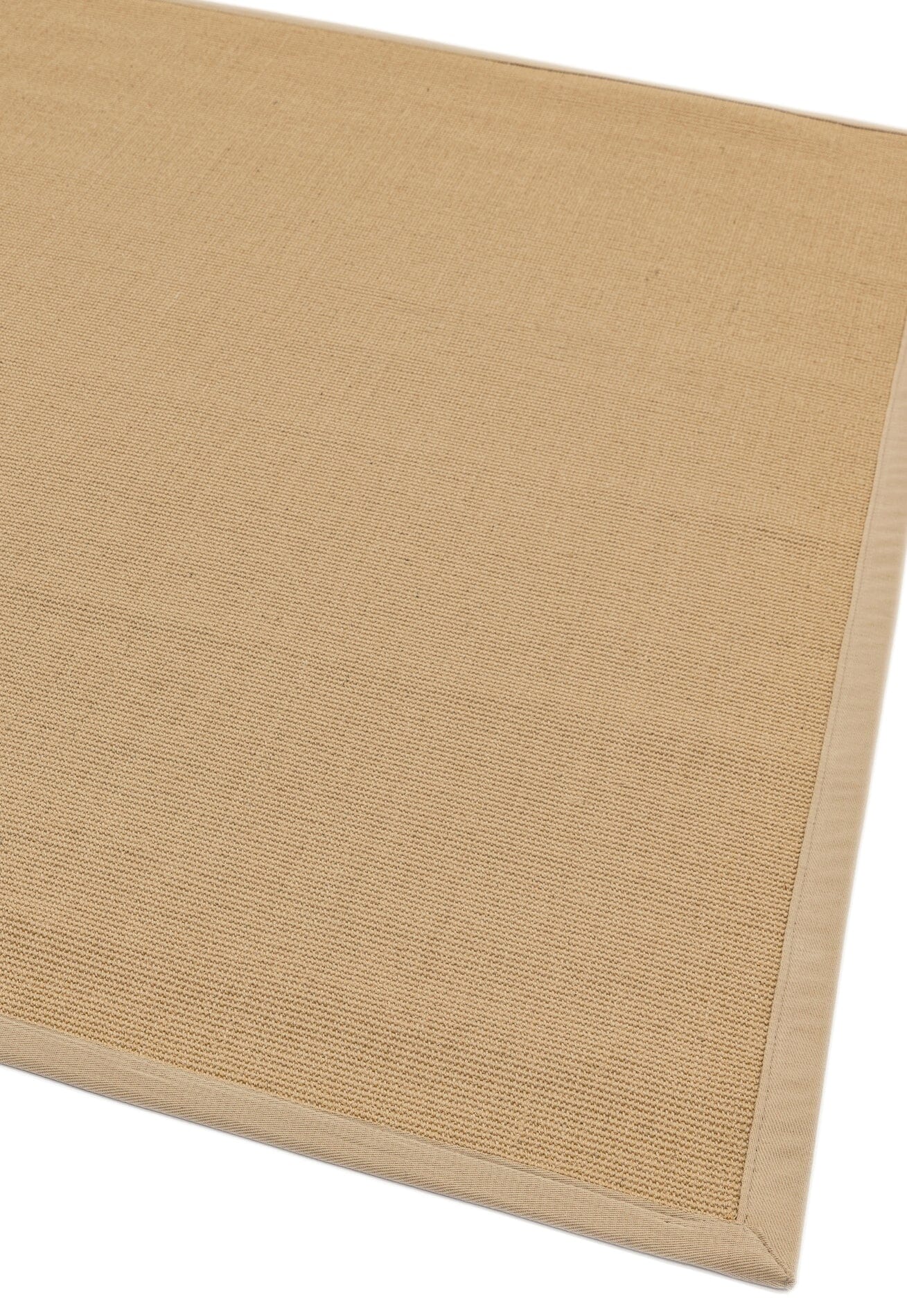 Low-pile beige rug with coordinated cotton trim

