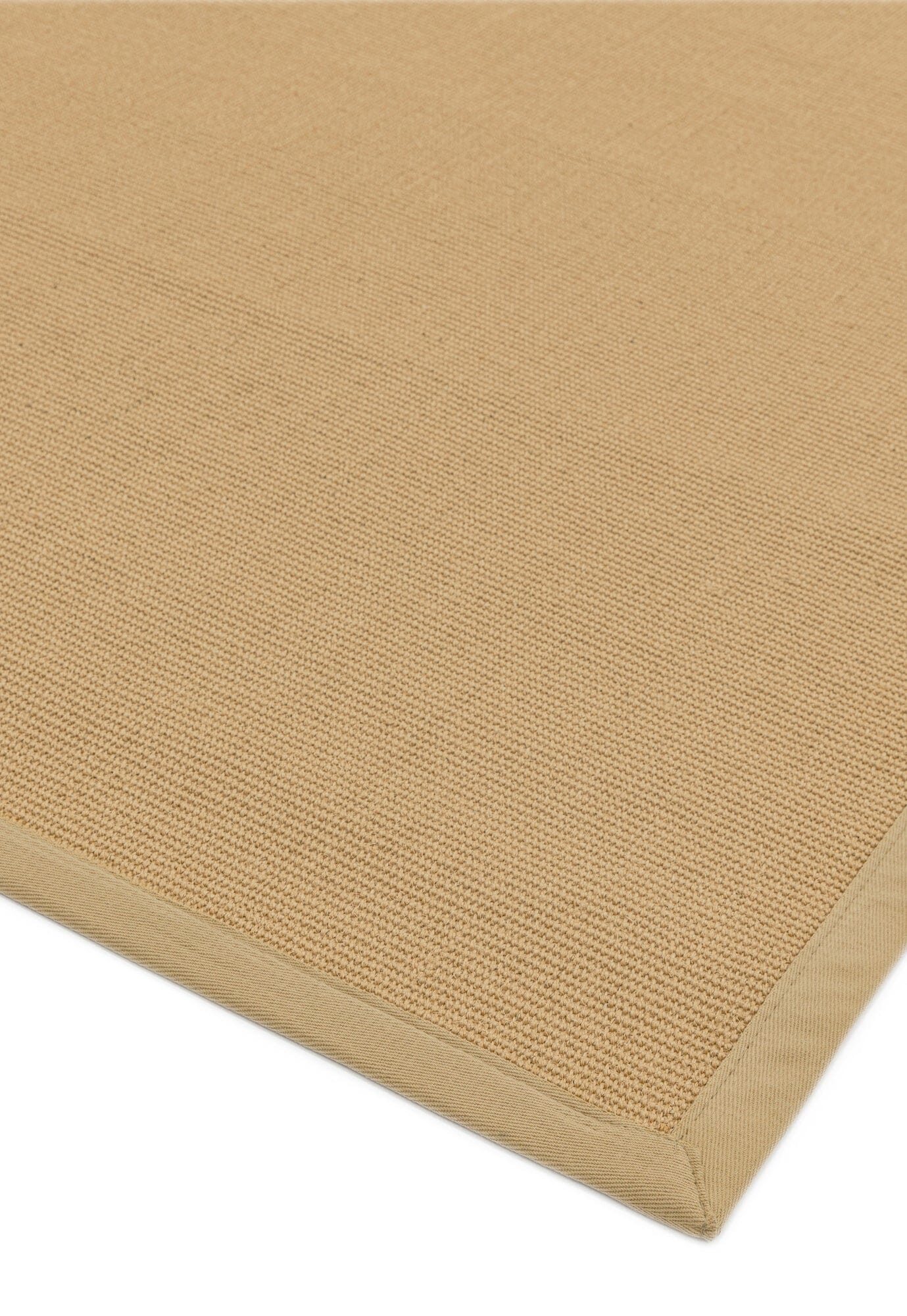 Hand-sewn linen border on sisal rug close-up

