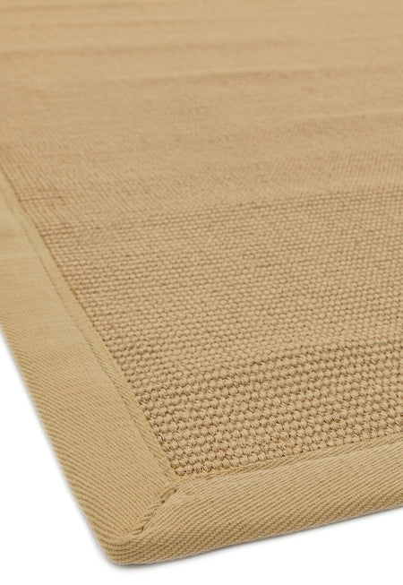 Neutral sisal rug styled with oak and soft tones

